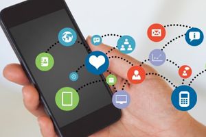 pic - Smart device in hand with diagram of their digital social network overlaid over it