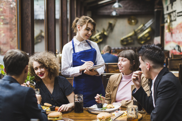 Pic - people ordering from a waitress at a restaurant